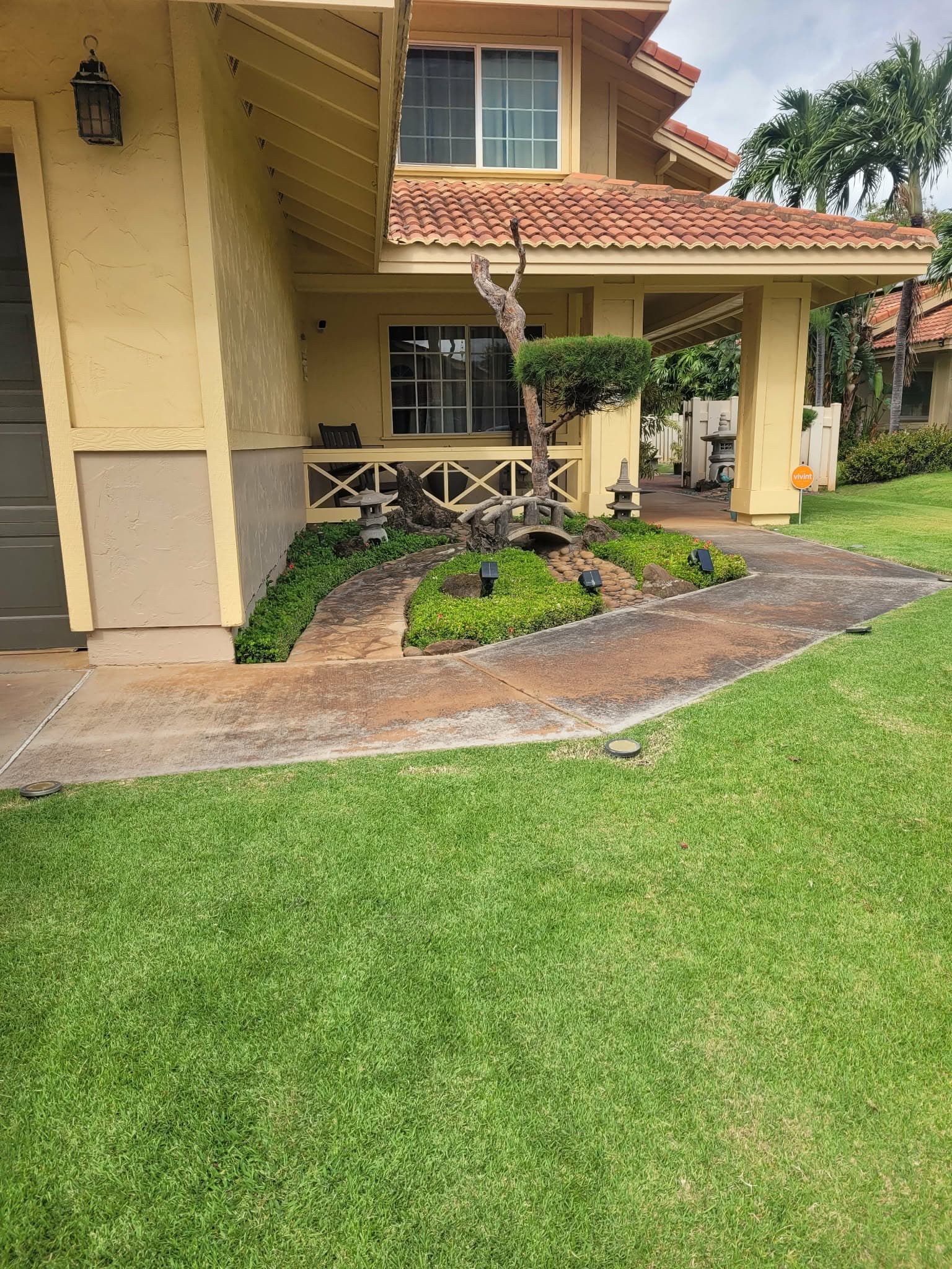 Manicured front entry garden and lawn